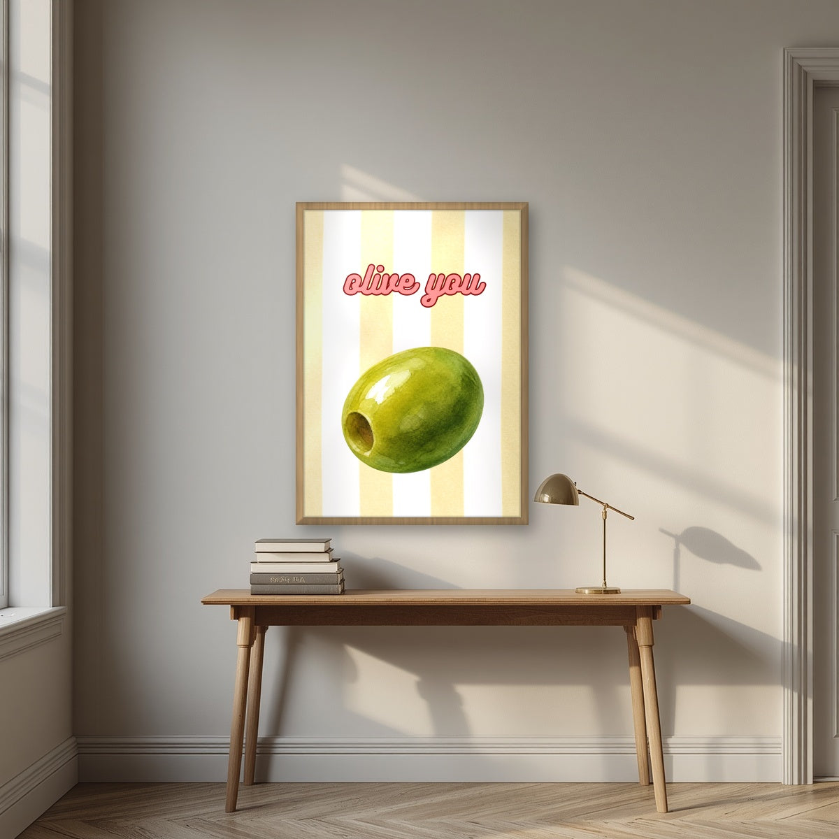 Olive You – Limoncello in an oak frame, above an oak writing desk