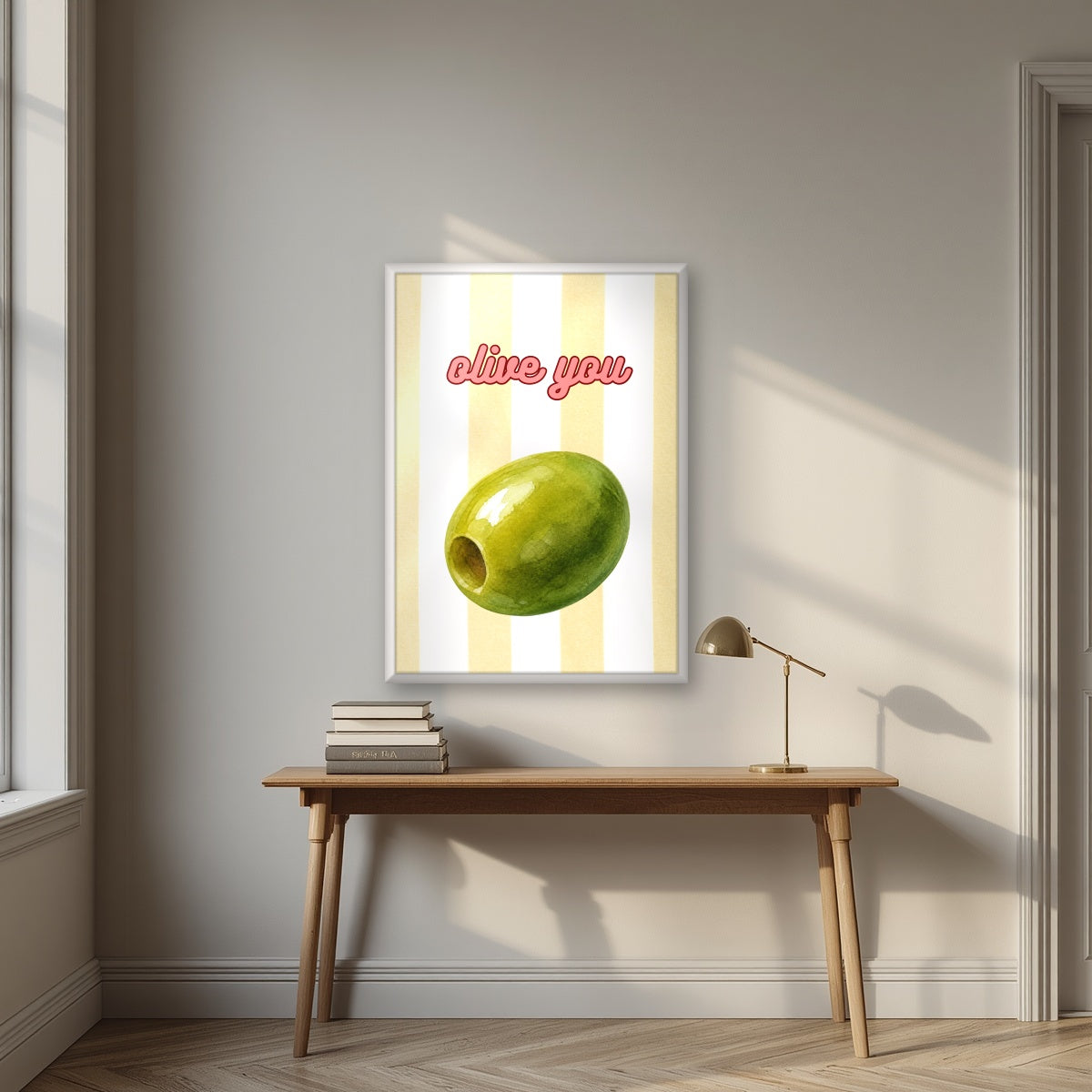 Olive You – Limoncello in a white frame, above an oak writing desk