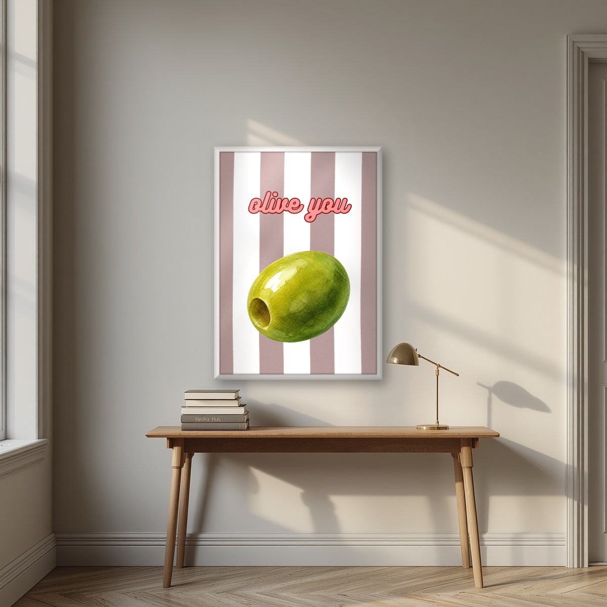 Olive You – Tuscan Taupe in a white frame, above an oak writing desk