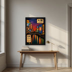 Dotonbori Dusk — Osaka art print, in a black frame, styled in a desk