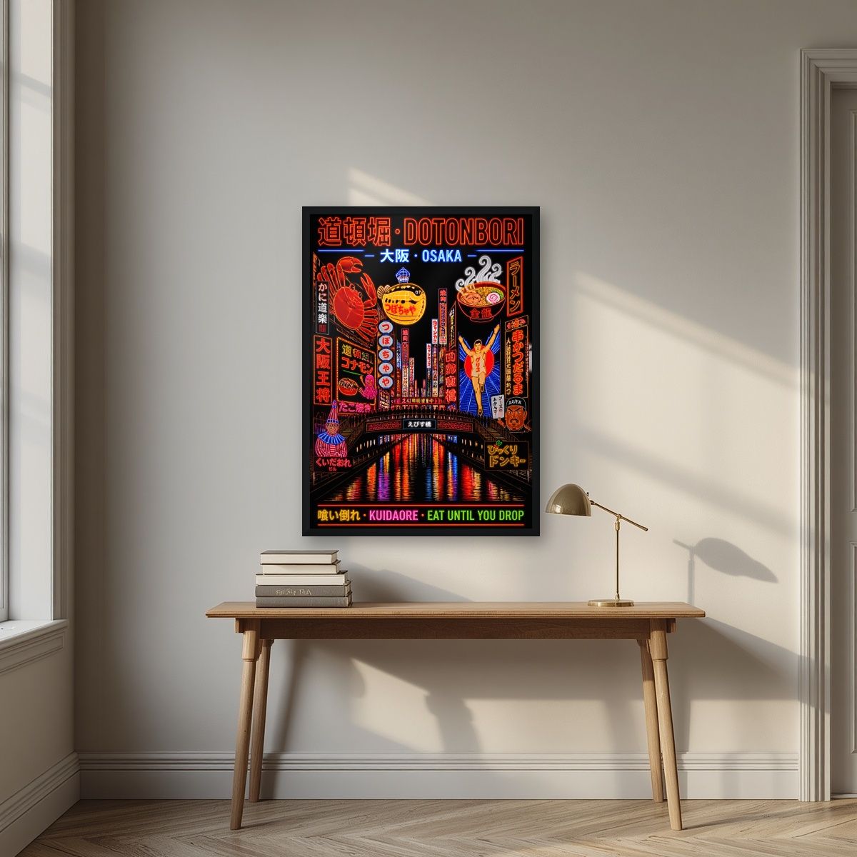Kuidaore — Osaka art print, in a black frame, styled in a desk
