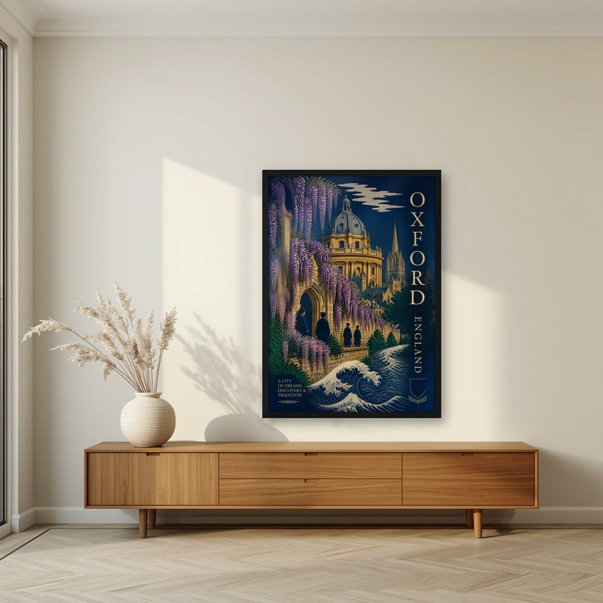 Oxford, A City of Dreams in a black frame, above a walnut sideboard in a living room