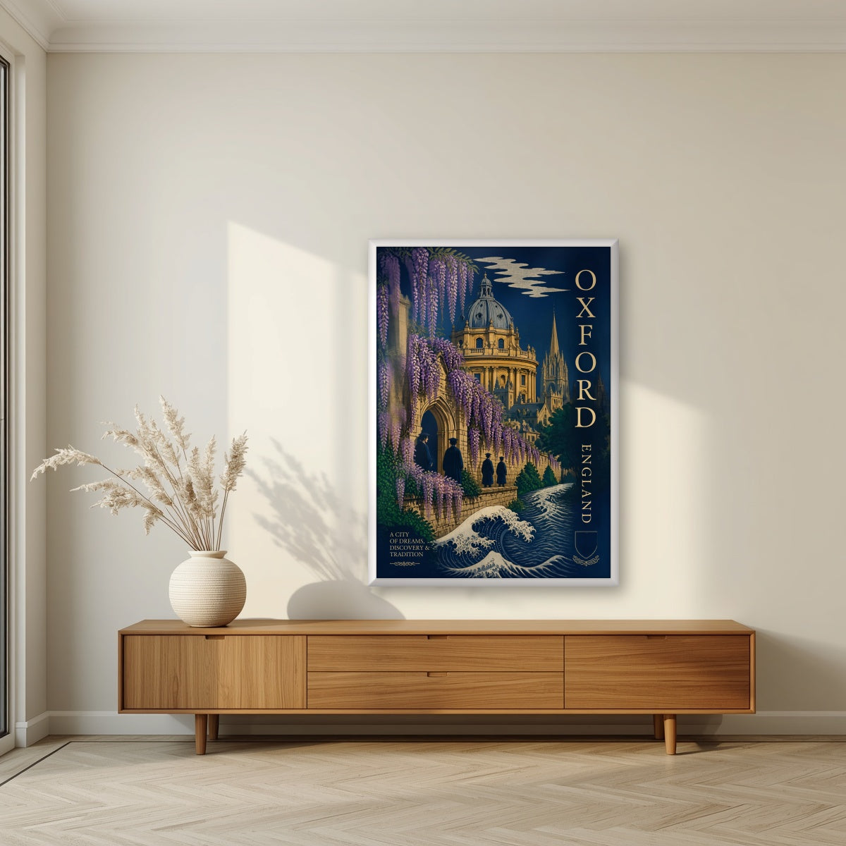 Oxford, A City of Dreams in a white frame, above a walnut sideboard in a living room
