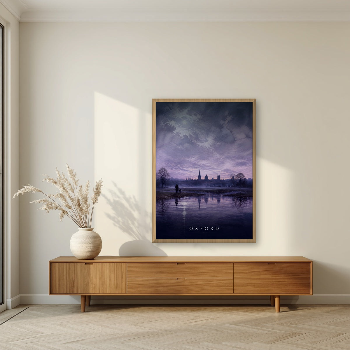 Oxford at Dusk in an oak frame, above a walnut sideboard in a living room