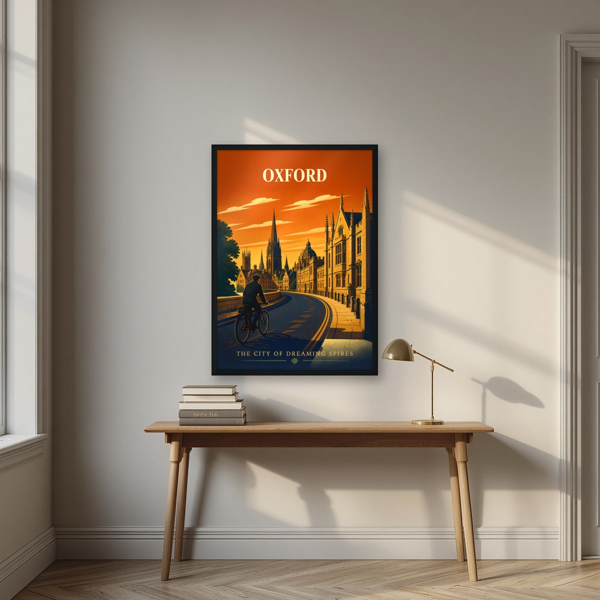 Oxford Dreaming Spires in a black frame, above an oak writing desk