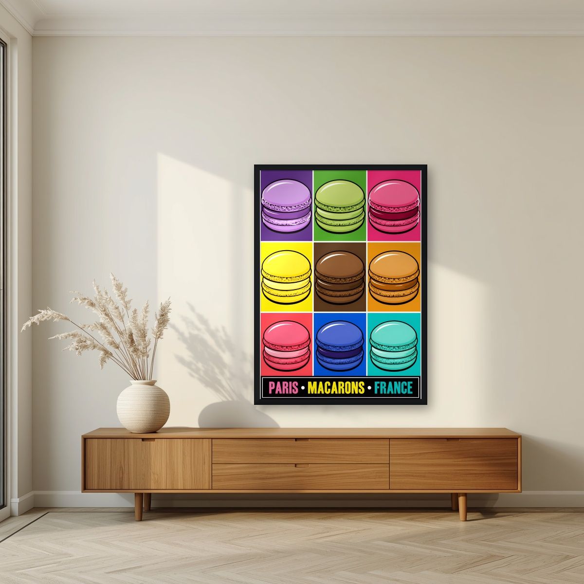 Macarons — Paris art print, in a black frame, styled in a living room