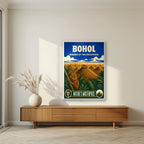 Tarsier Vista — Bohol art print, in a white frame, styled in a living room