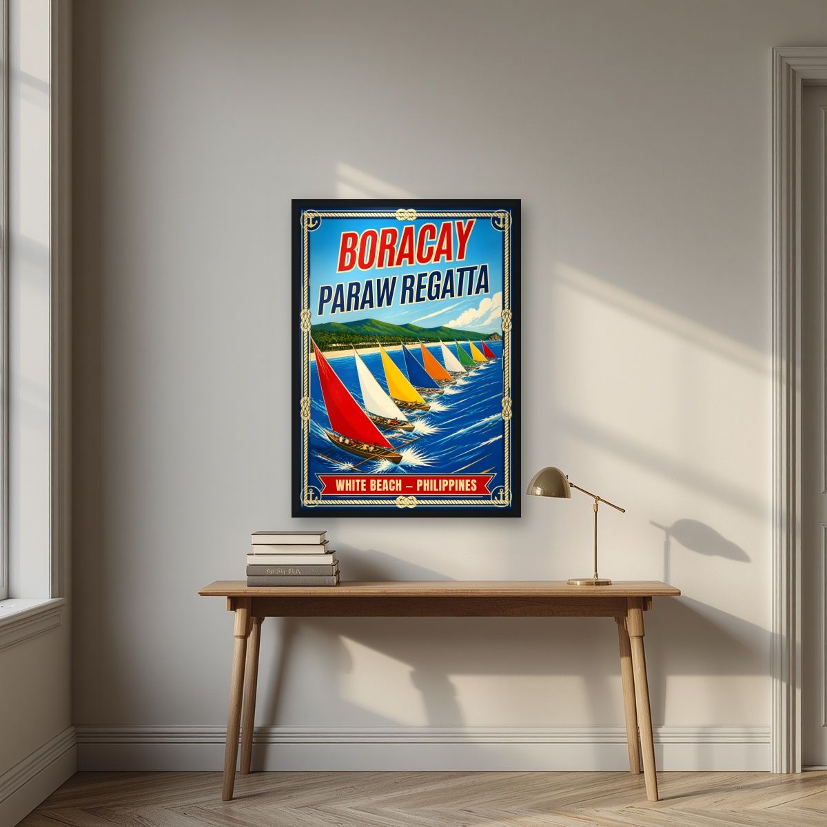 Paraw Regatta — Boracay art print, in a black frame, styled in a desk