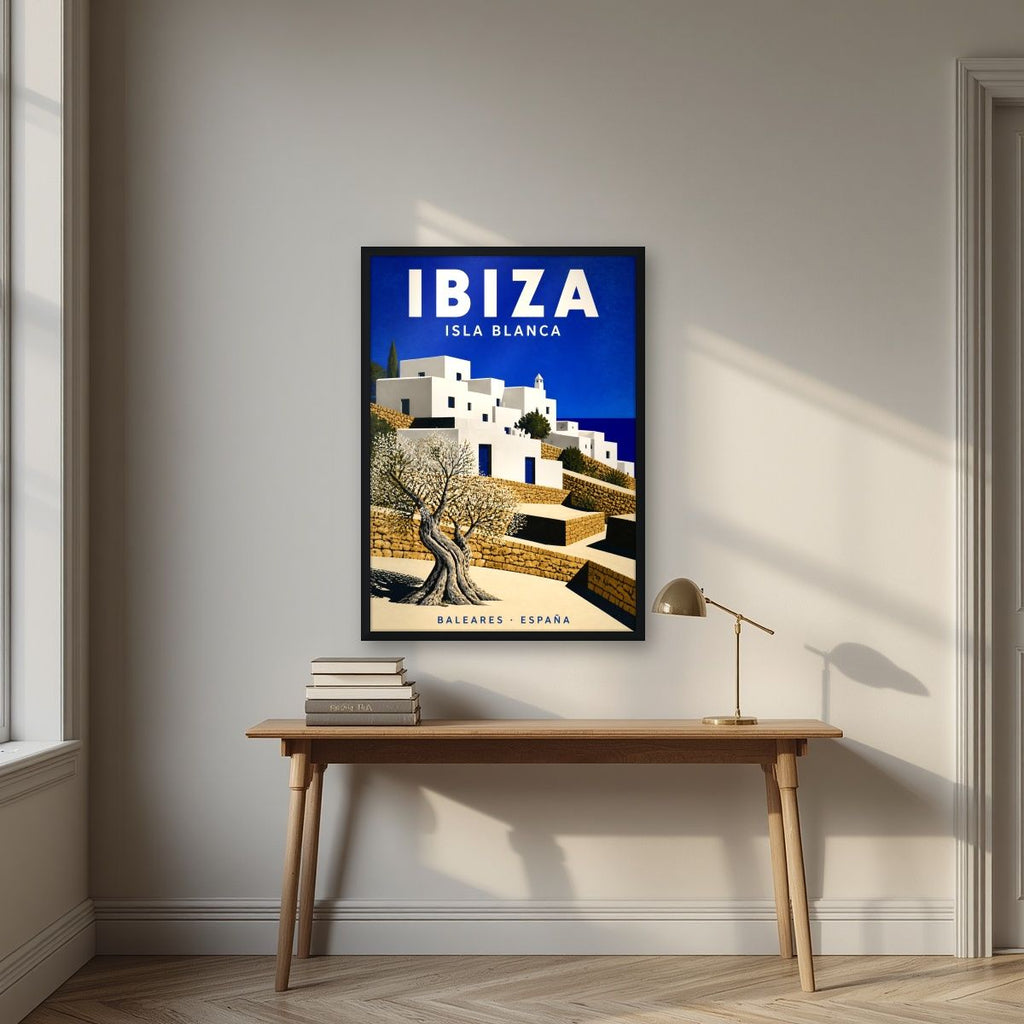 Isla Blanca — Ibiza art print, in a black frame, styled in a desk