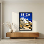 Isla Blanca — Ibiza art print, in a black frame, styled in a living room