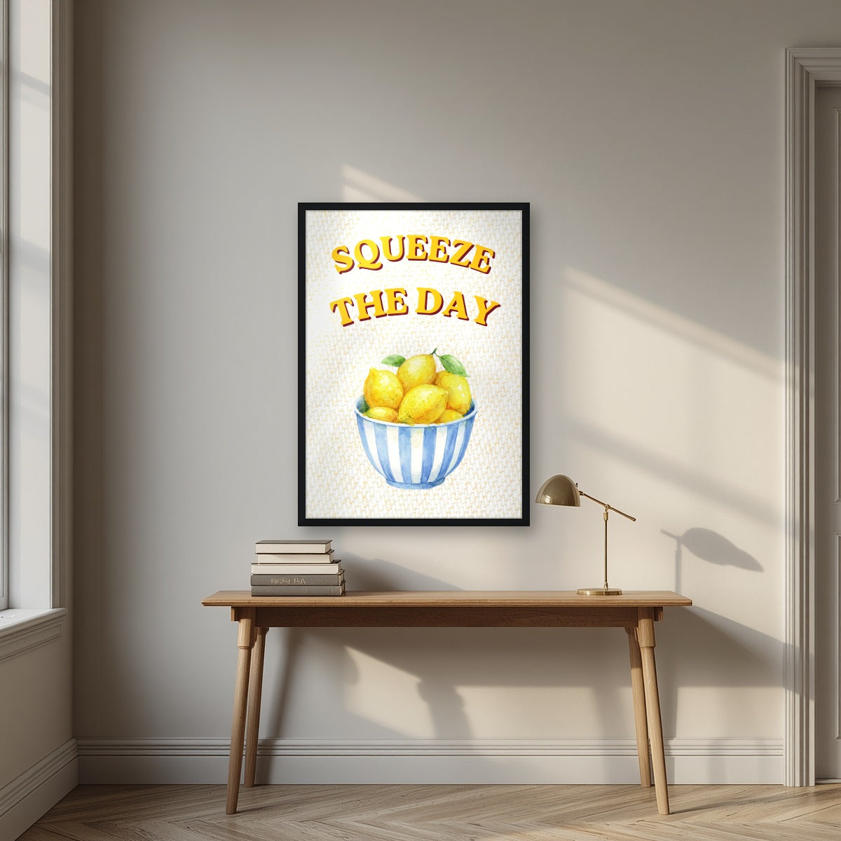 Squeeze The Day – Limoncello in a black frame, above an oak writing desk