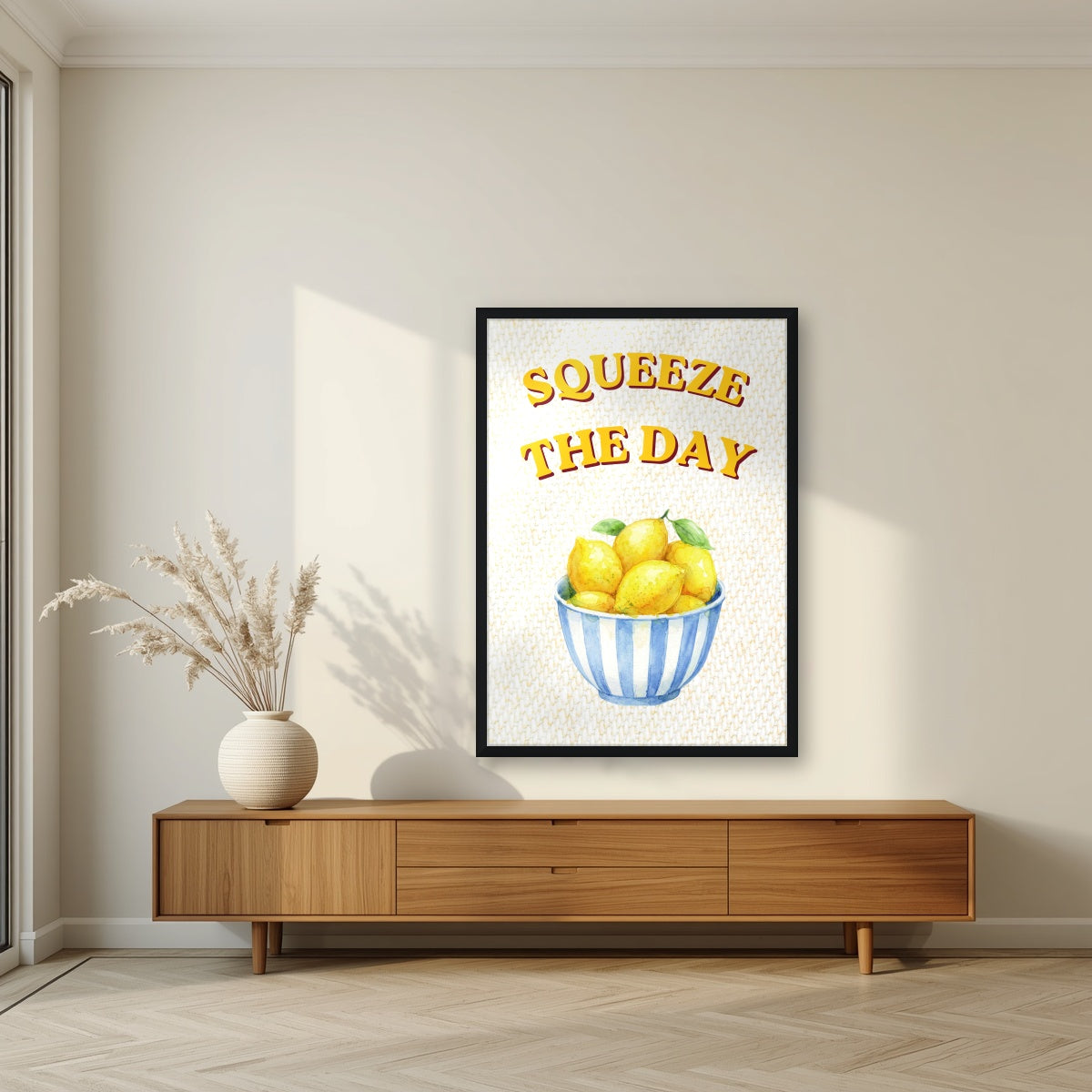 Squeeze The Day – Limoncello in a black frame, above a walnut sideboard in a living room