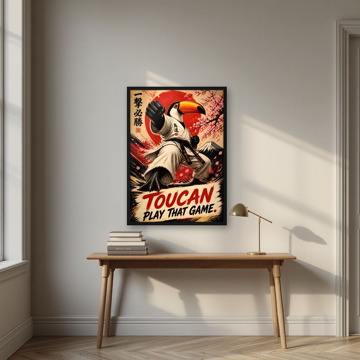 Black Belt Beak — Toucan Play That Game art print, in a black frame, styled in a desk