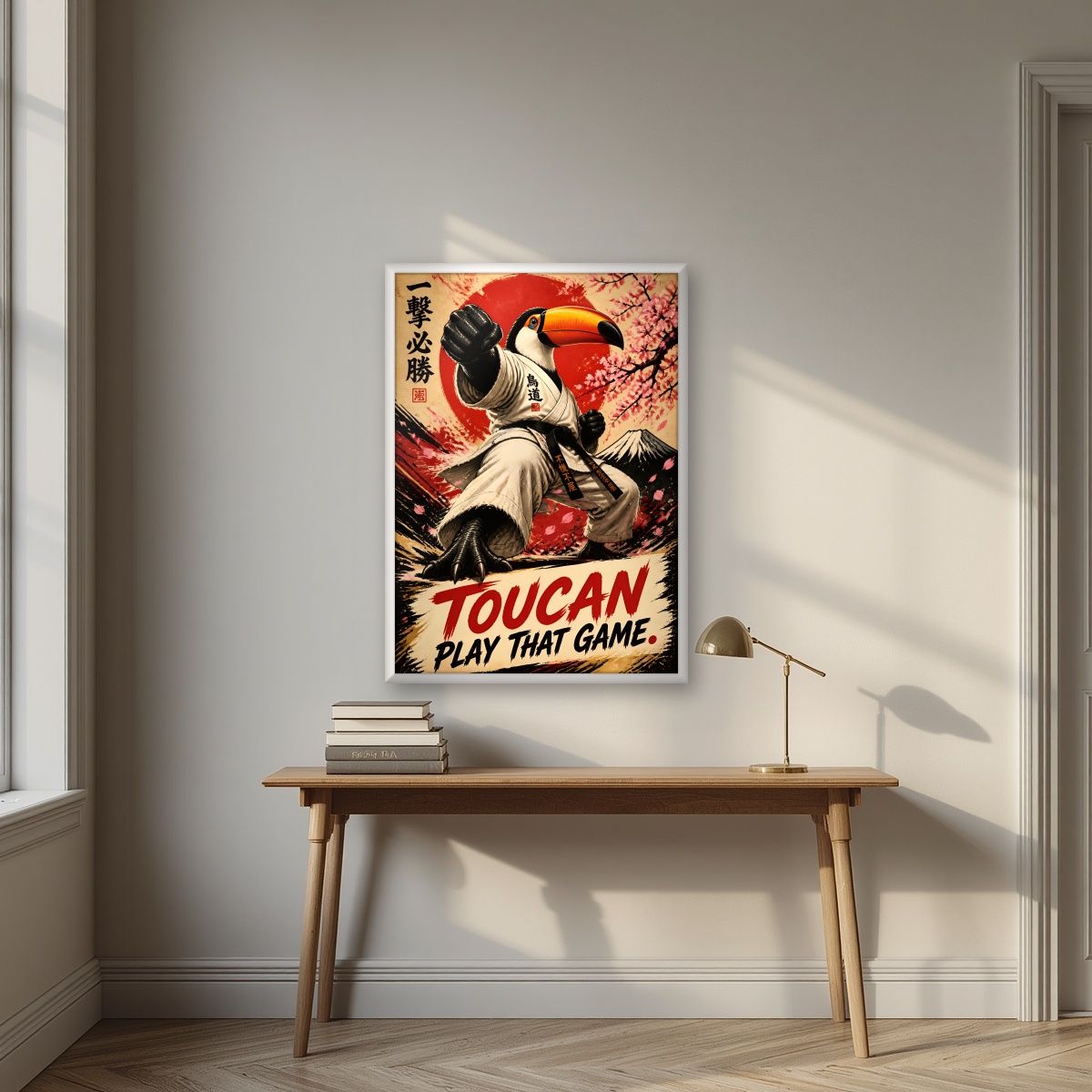 Black Belt Beak — Toucan Play That Game art print, in a white frame, styled in a desk