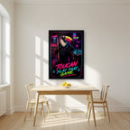 Cue the Neon — Toucan Play That Game art print, in a black frame, styled in a kitchen