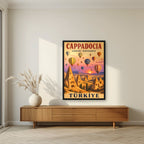 Balloons at Dawn — Cappadocia art print, in a black frame, styled in a living room