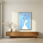 What The Duck – Deckchair Blue art print in an oak frame, styled in a living room