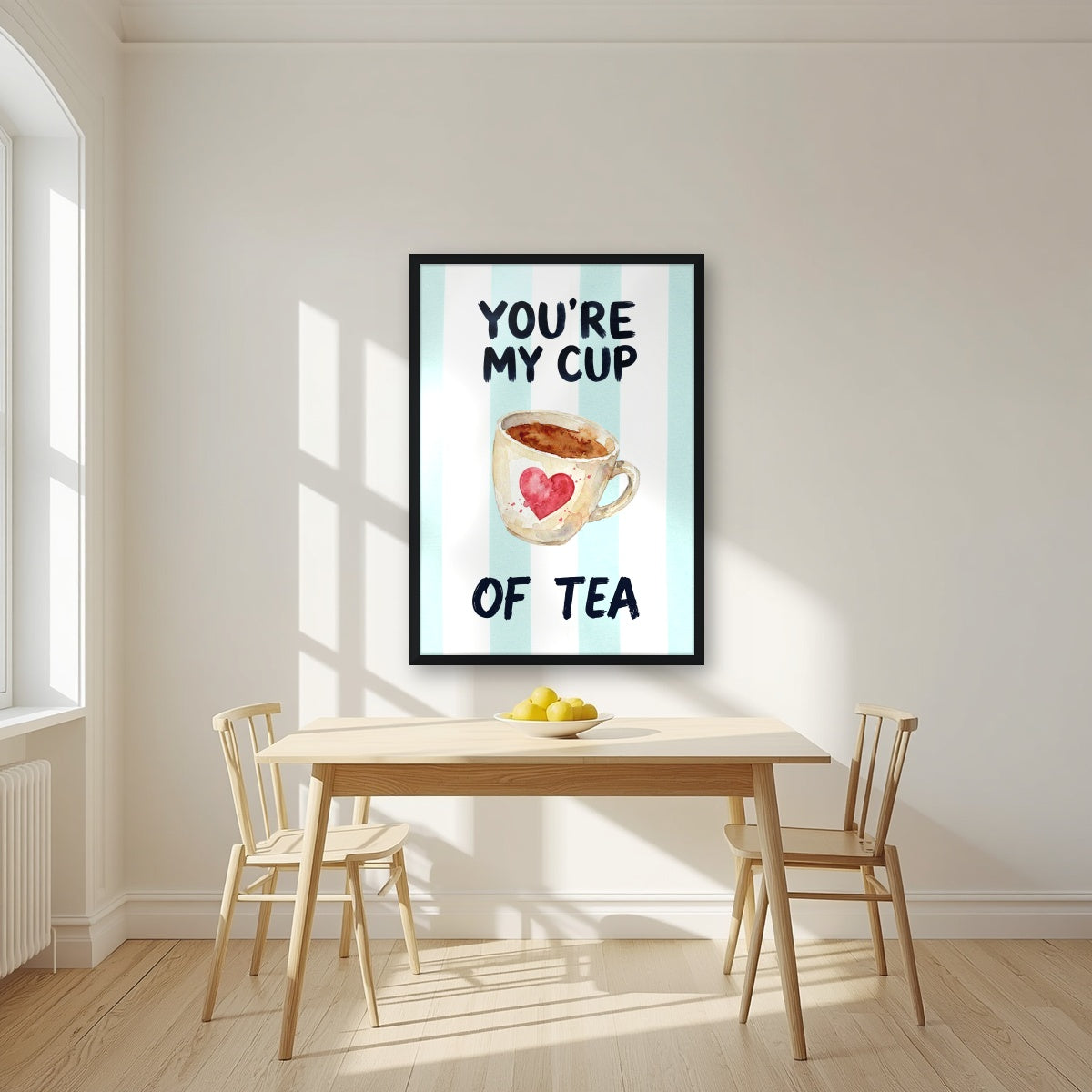 You're My Cup of Tea – Amalfi Aqua in a black frame, above a dining table in a bright kitchen