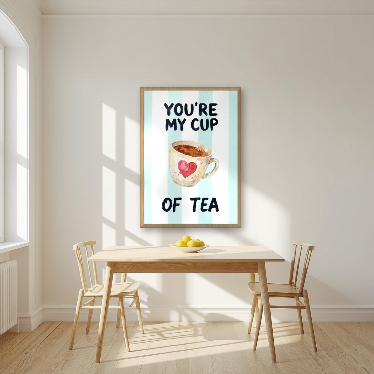 You're My Cup of Tea – Amalfi Aqua in an oak frame, above a dining table in a bright kitchen