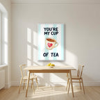 You're My Cup of Tea – Amalfi Aqua in a white frame, above a dining table in a bright kitchen