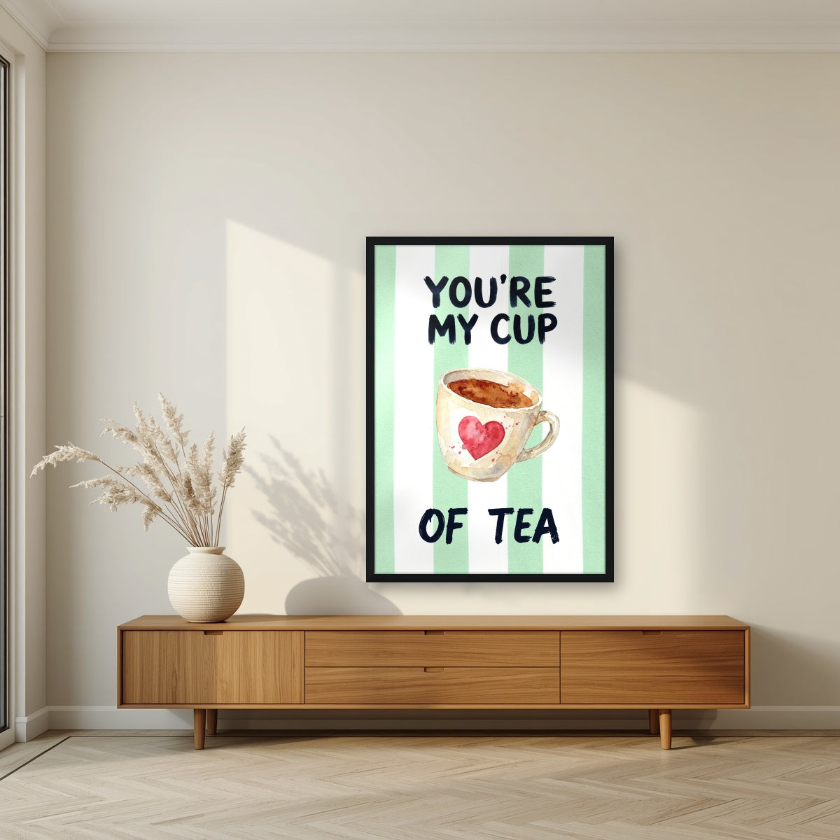 You're My Cup of Tea – Cabana Green in a black frame, above a walnut sideboard in a living room