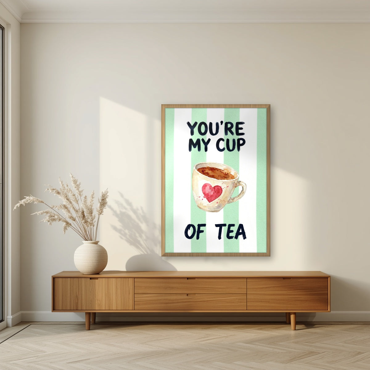 You're My Cup of Tea – Cabana Green in an oak frame, above a walnut sideboard in a living room