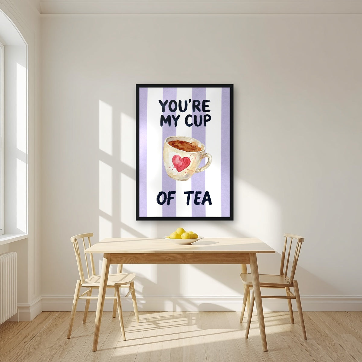 You're My Cup of Tea – Capri Violet in a black frame, above a dining table in a bright kitchen