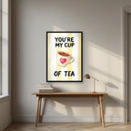 You're My Cup of Tea – Limoncello in a black frame, above an oak writing desk