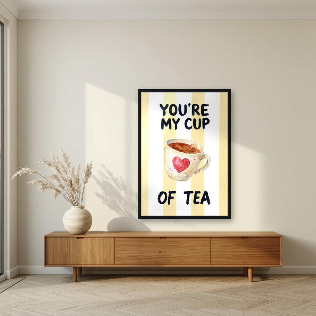 You're My Cup of Tea – Limoncello in a black frame, above a walnut sideboard in a living room
