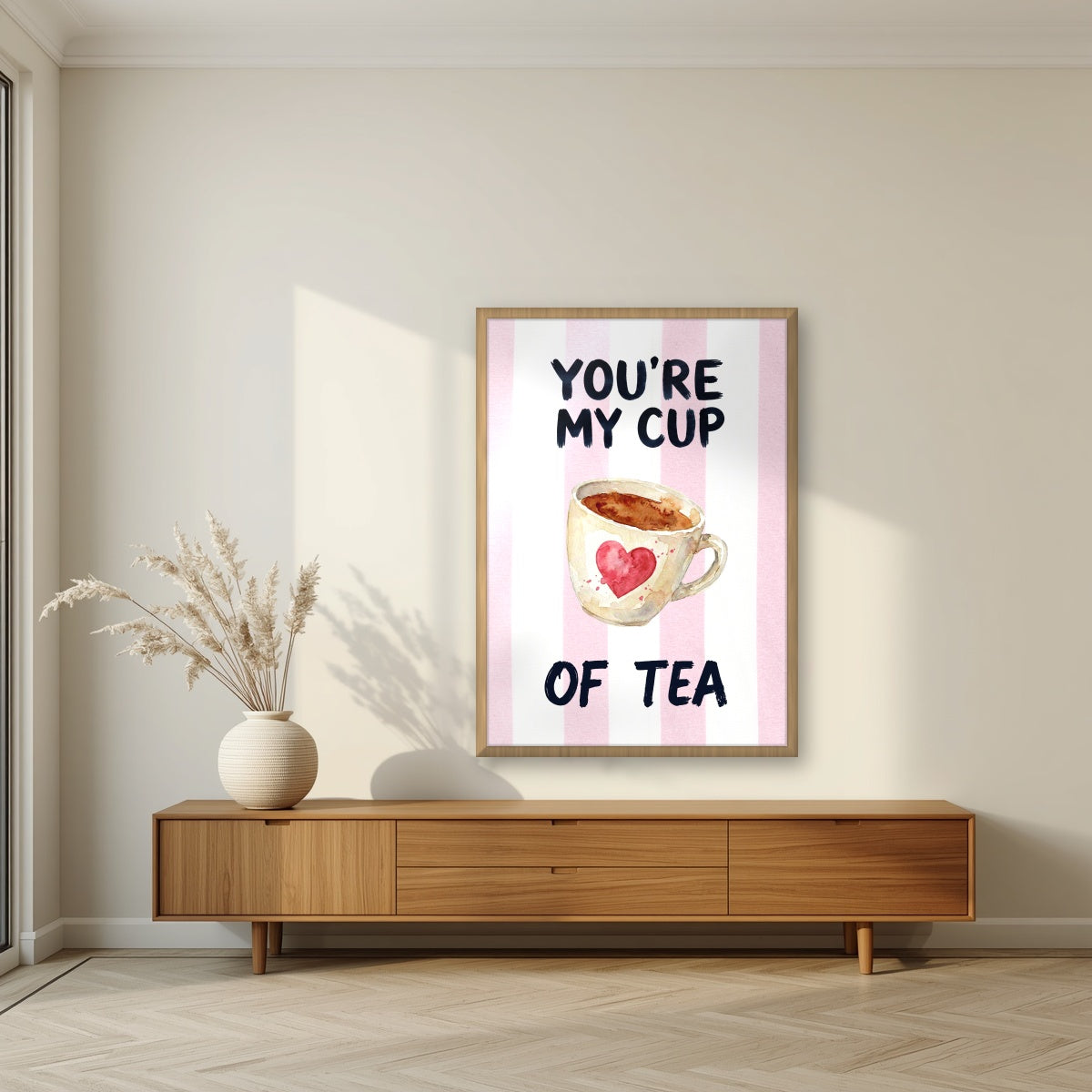 You're My Cup of Tea – Positano Pink in an oak frame, above a walnut sideboard in a living room