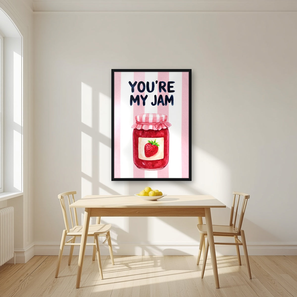 You're My Jam – Positano Pink in a black frame, above a dining table in a bright kitchen