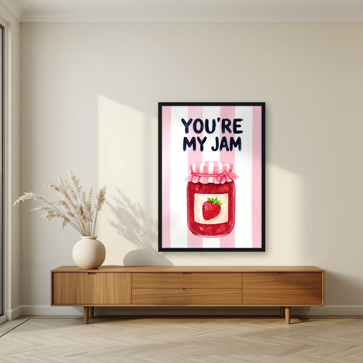 You're My Jam – Positano Pink in a black frame, above a walnut sideboard in a living room