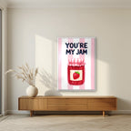 You're My Jam – Positano Pink in a white frame, above a walnut sideboard in a living room