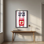 You're My Jam – Tuscan Taupe in a black frame, above an oak writing desk
