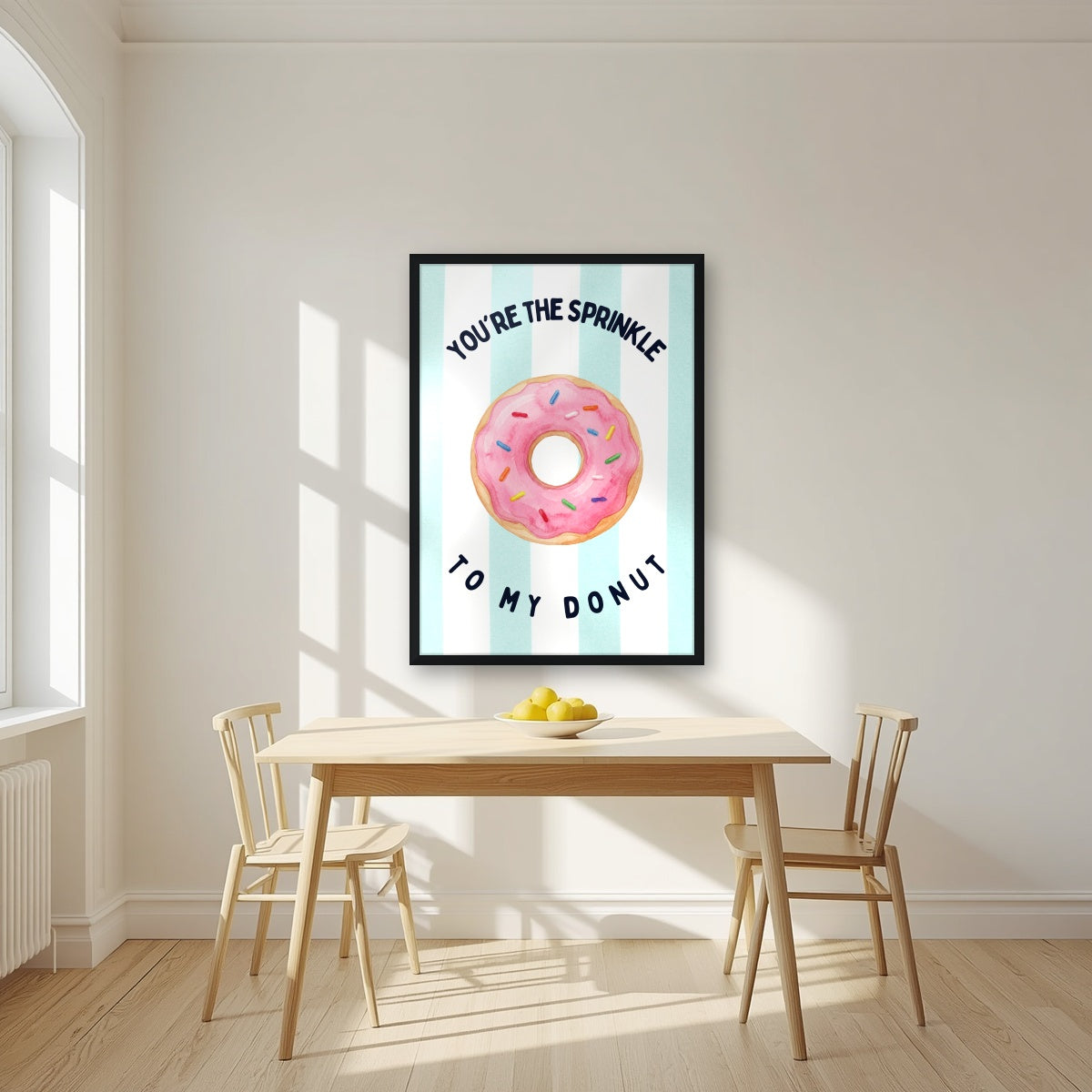 You're the Sprinkle to My Donut – Amalfi Aqua in a black frame, above a dining table in a bright kitchen