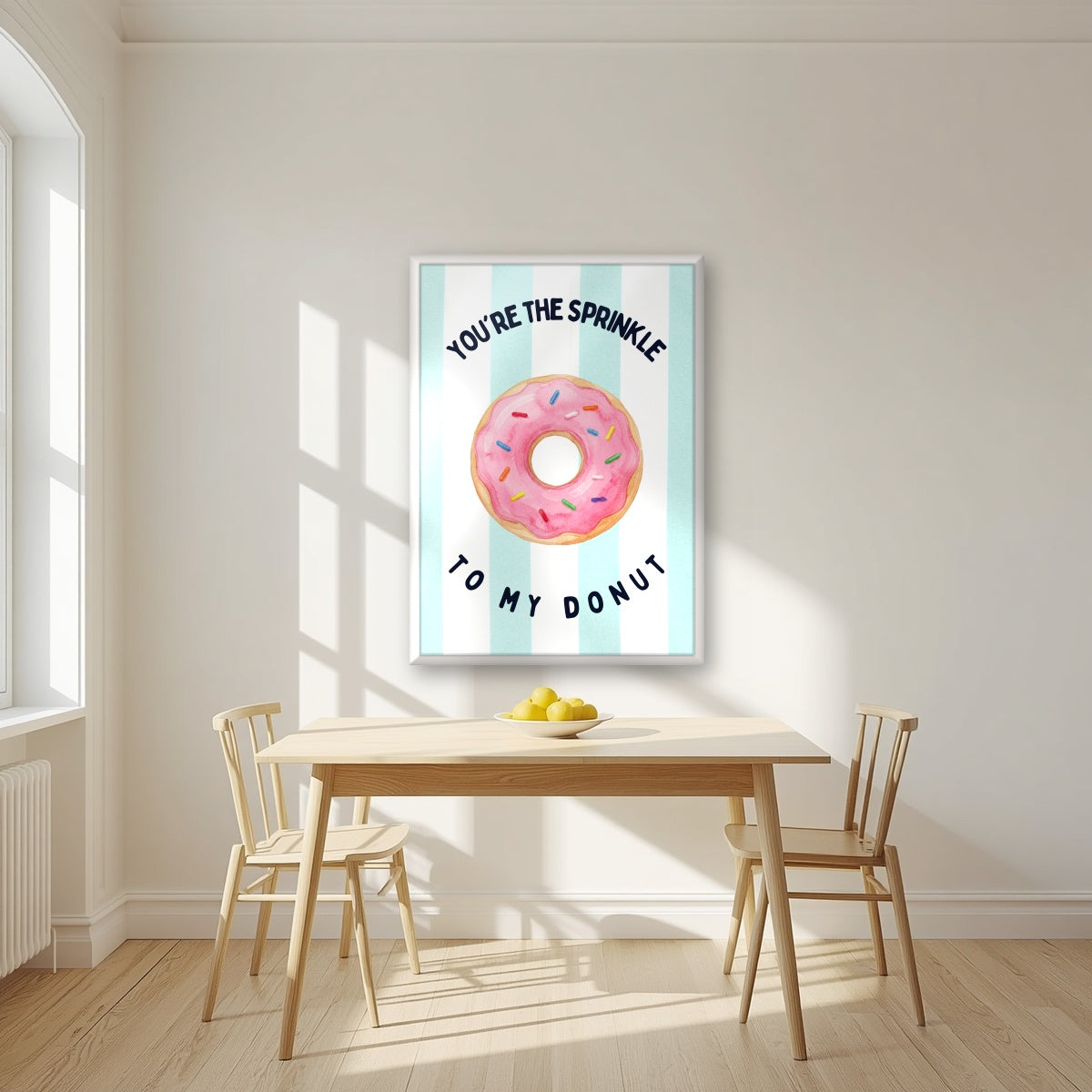 You're the Sprinkle to My Donut – Amalfi Aqua in a white frame, above a dining table in a bright kitchen