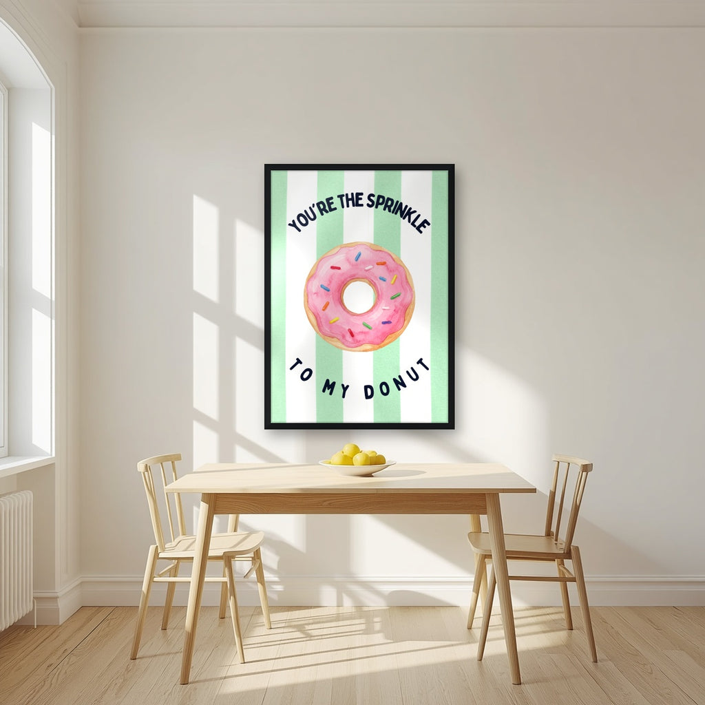 You're the Sprinkle to My Donut – Cabana Green in a black frame, above a dining table in a bright kitchen