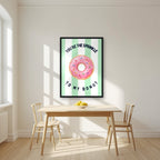 You're the Sprinkle to My Donut – Cabana Green in a black frame, above a dining table in a bright kitchen