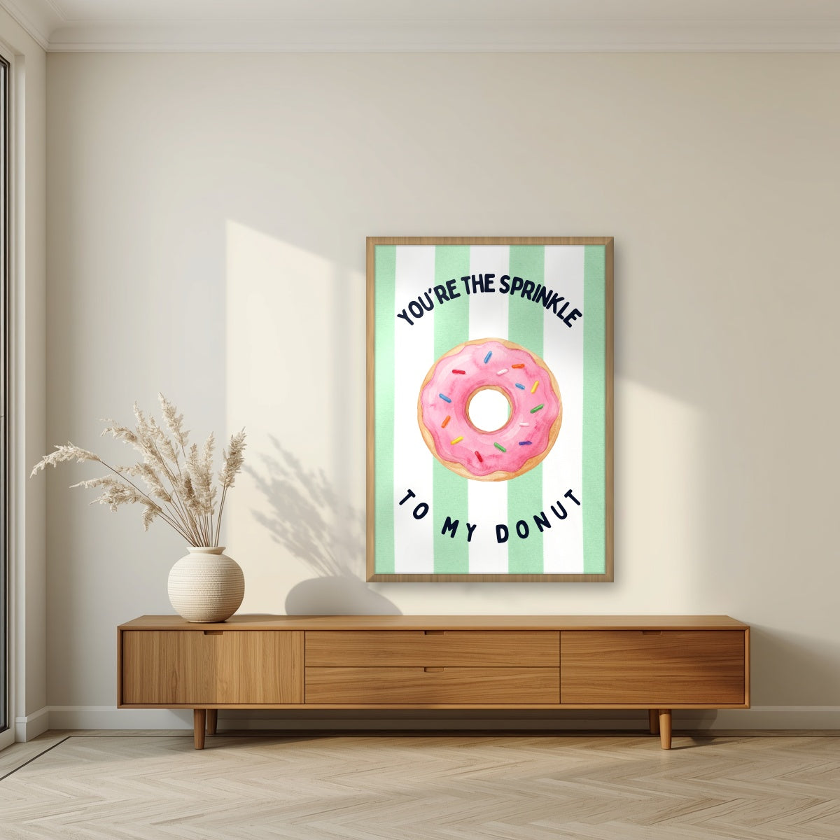 You're the Sprinkle to My Donut – Cabana Green in an oak frame, above a walnut sideboard in a living room