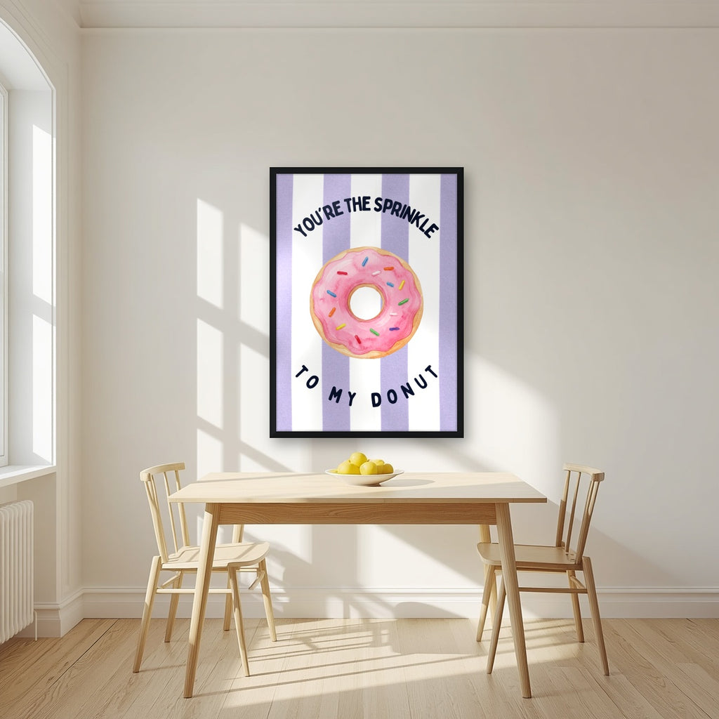 You're the Sprinkle to My Donut – Capri Violet in a black frame, above a dining table in a bright kitchen