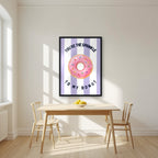 You're the Sprinkle to My Donut – Capri Violet in a black frame, above a dining table in a bright kitchen