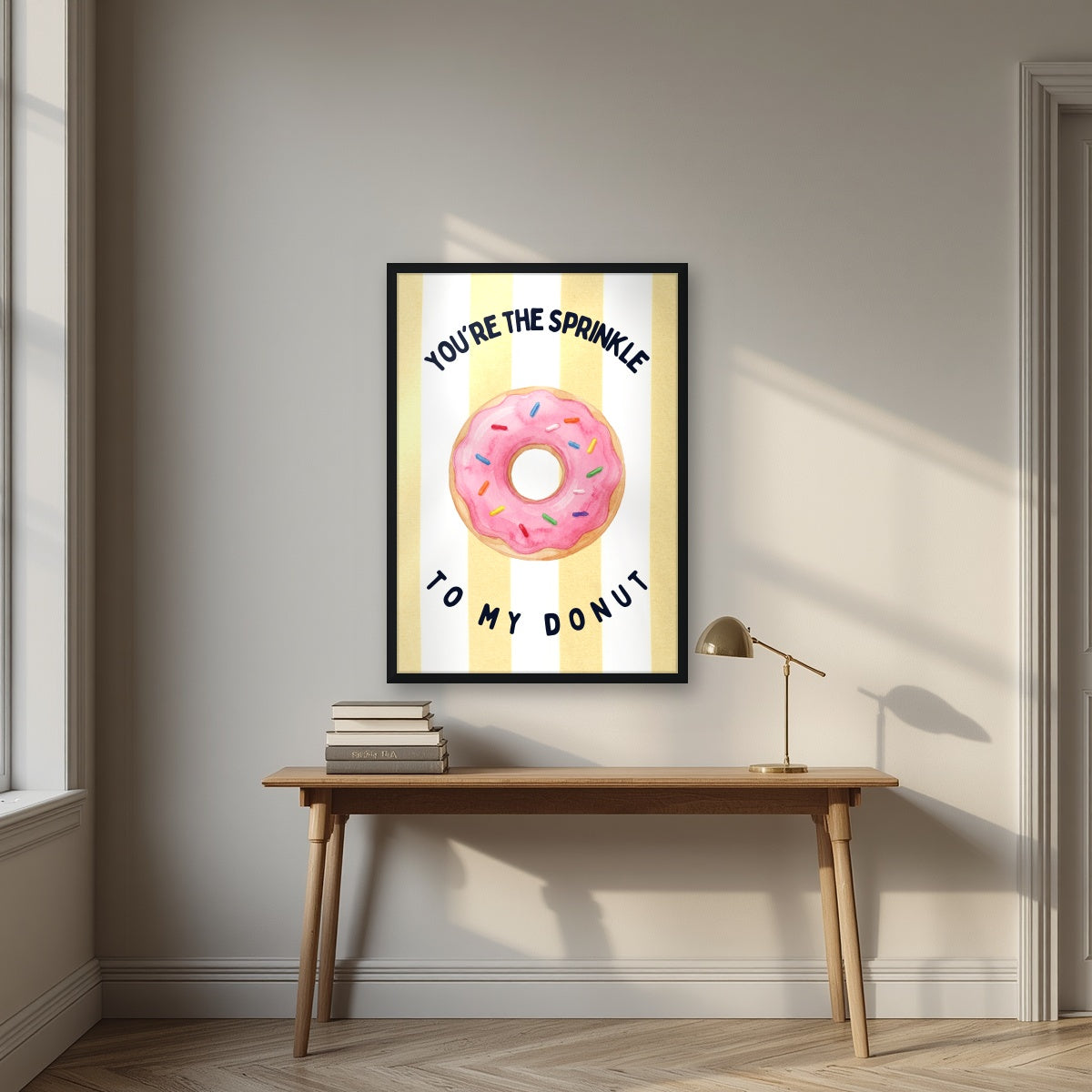 You're the Sprinkle to My Donut – Limoncello in a black frame, above an oak writing desk