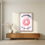 You're the Sprinkle to My Donut – Positano Pink in an oak frame, above a walnut sideboard in a living room