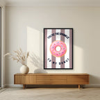 You're the Sprinkle to My Donut – Tuscan Taupe in a black frame, above a walnut sideboard in a living room